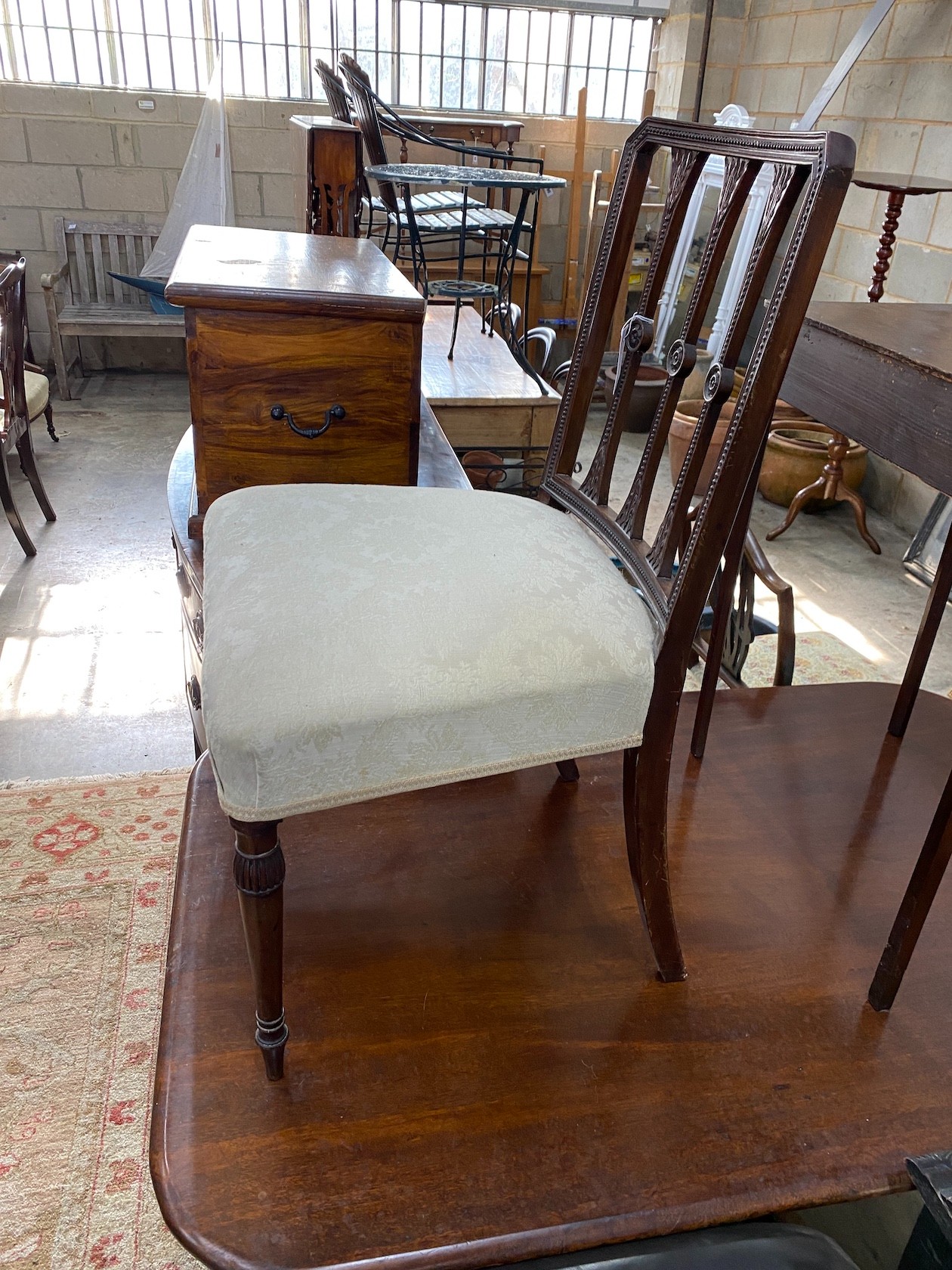 A George III carved mahogany dining chair
